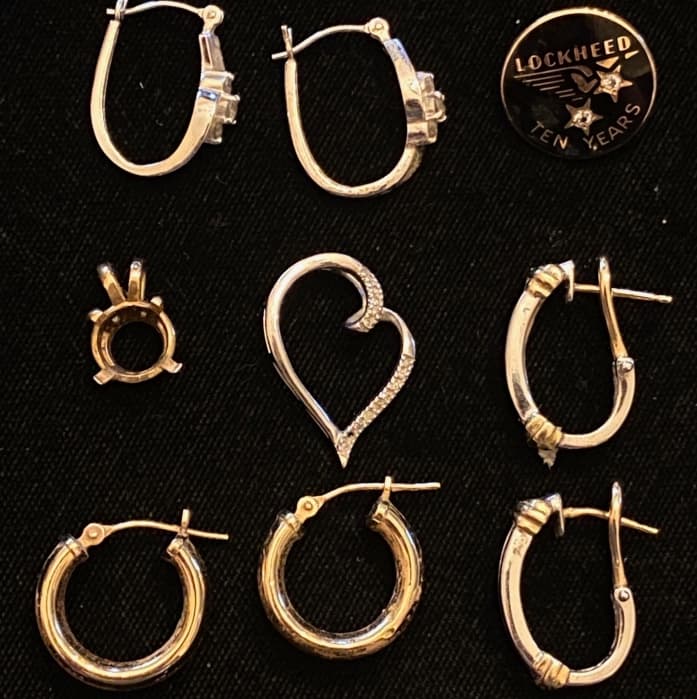 a-variety-of-14k-gold-earrings-and-pendants